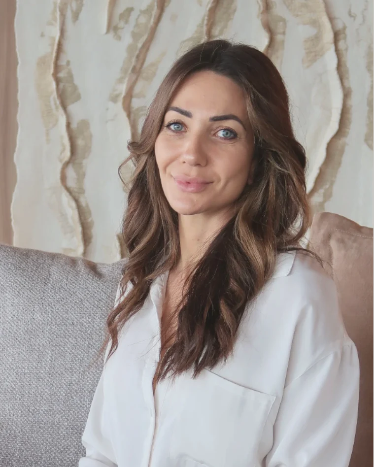 Sabrina Ungaro, KAILO practitioner, in a white shirt.